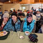 Winter youth retreat participants gather for breakfast before going skiing