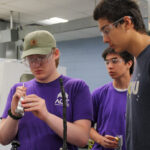 ACE program participants work in machine shop