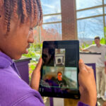 Student takes virtual guest to see doghouses at Spot robot doghouse competition