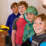 Spot robot meets student visitors during summer STEAM camp